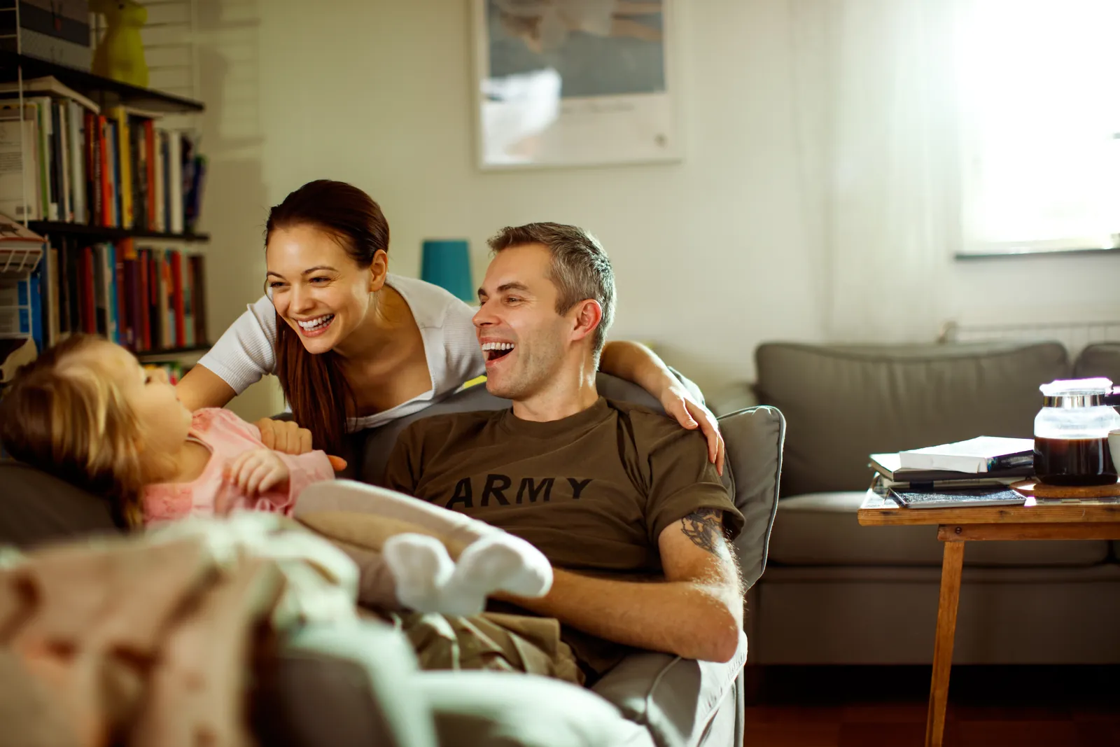 Florida veteran family relaxing in their newly built home financed with a VA one-time close construction loan from PBT Bancorp
