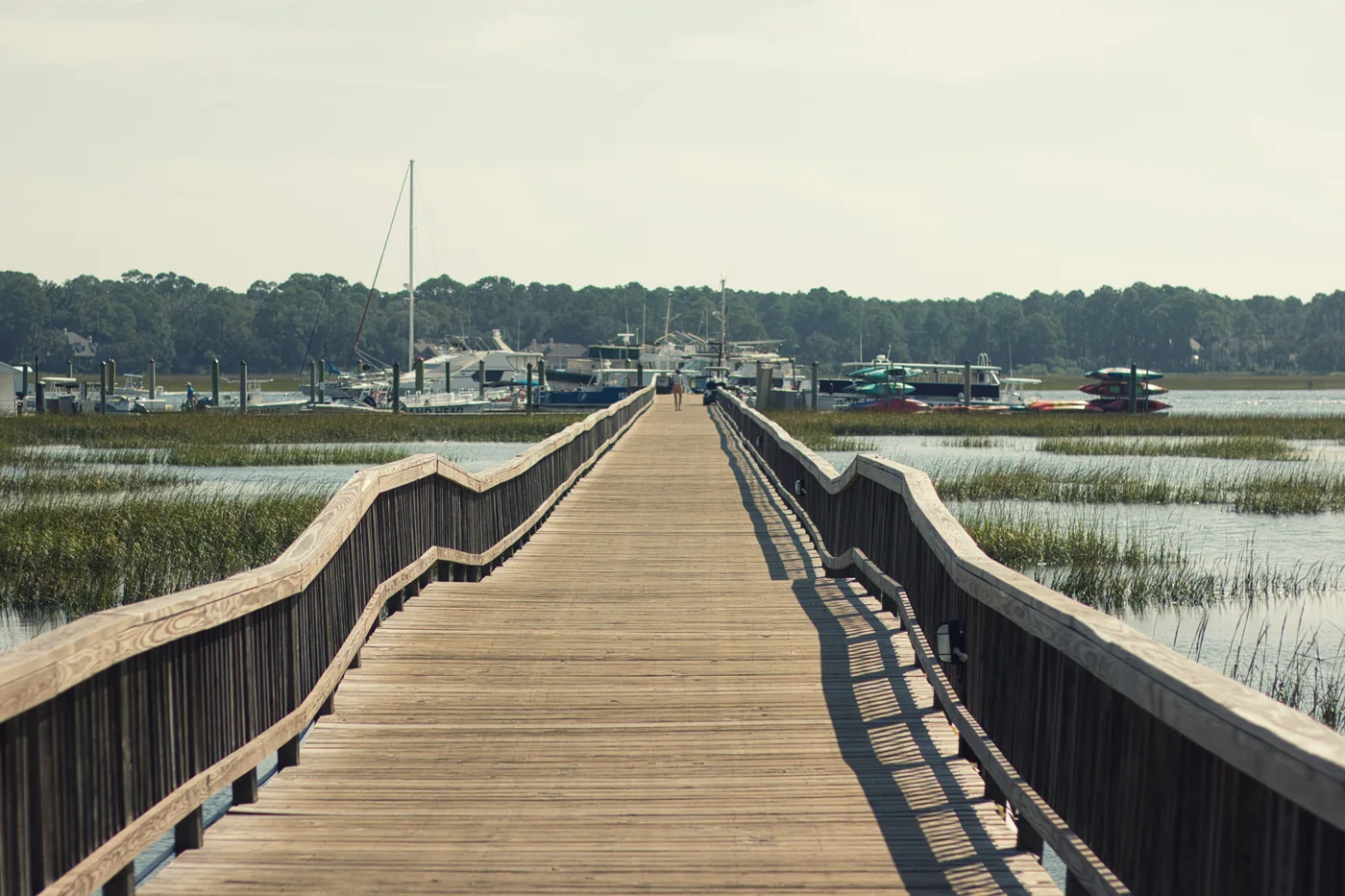 Wooden dock reaching over the May River at Bluffton, South Carolina, where PBT Bancorp helps military retirees and Veterans buy homes with VA loans