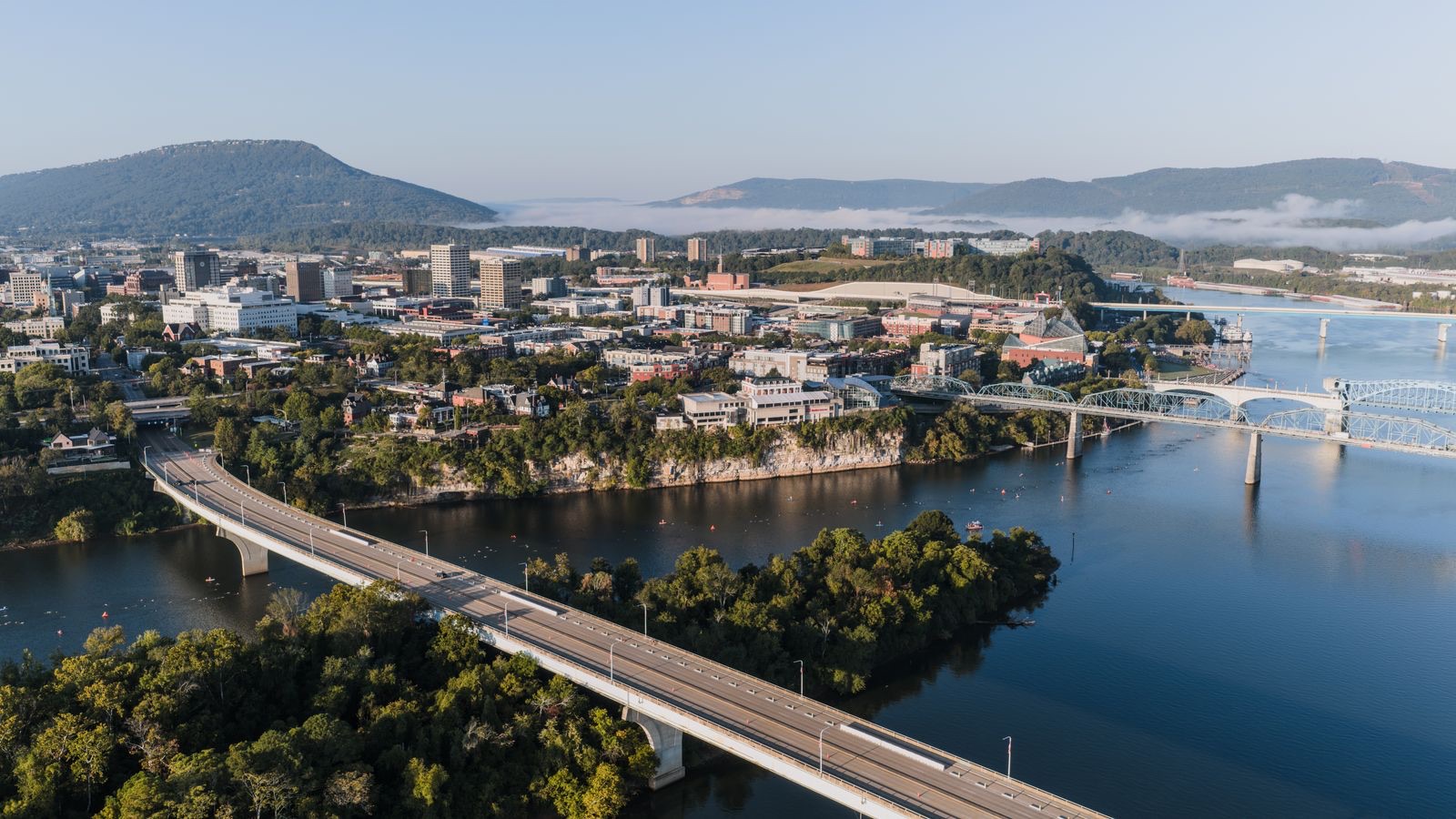 Aerial view of Chattanooga, Tennessee with the Tennessee River, Walnut Street Bridge, and Lookout Mountain, where PBT Bancorp helps Veterans with VA loans