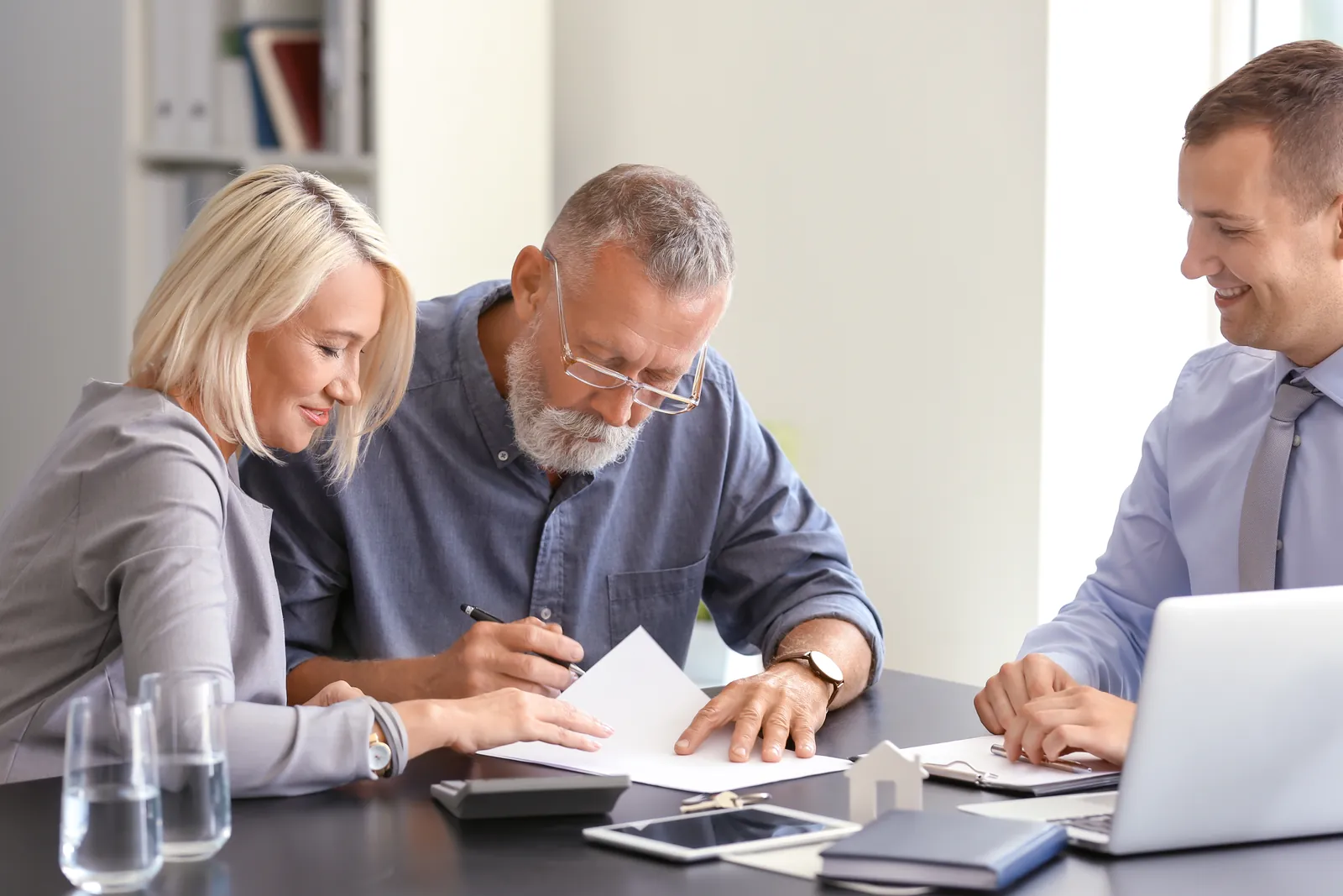PBT Bancorp loan officer helping a North Carolina veteran couple review their VA one-time close construction loan