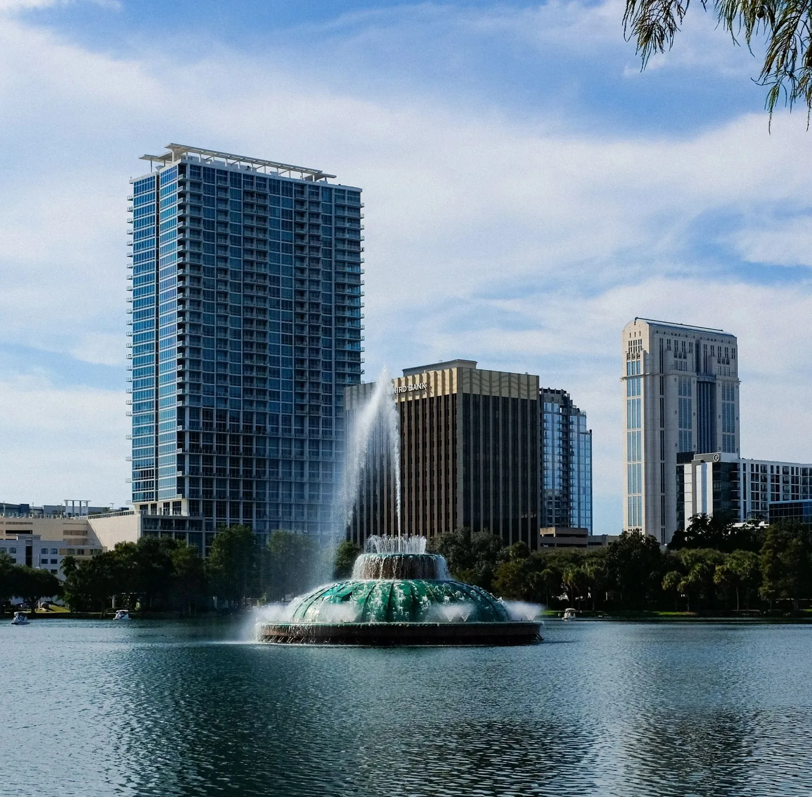 Downtown Orlando skyline and the Lake Eola fountain on a bright day, where PBT Bancorp helps Veterans buy with VA loans
