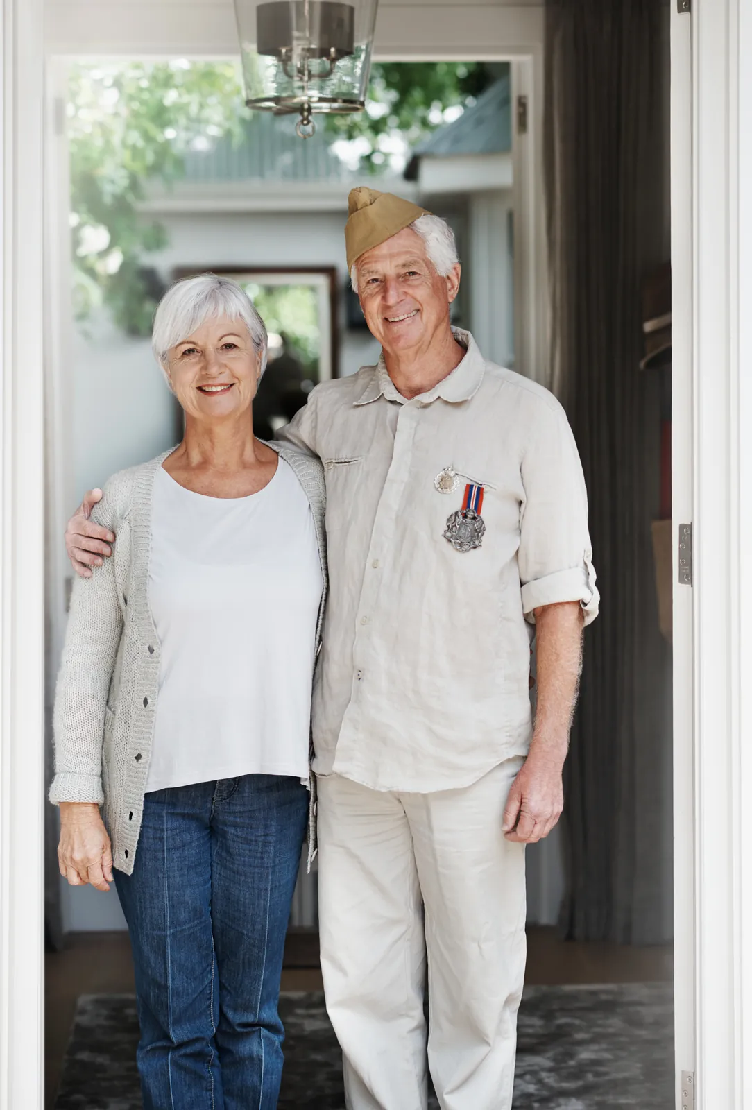 Veteran couple at home after reviewing VA IRRRL refinance options with PBT Bancorp Mortgage
