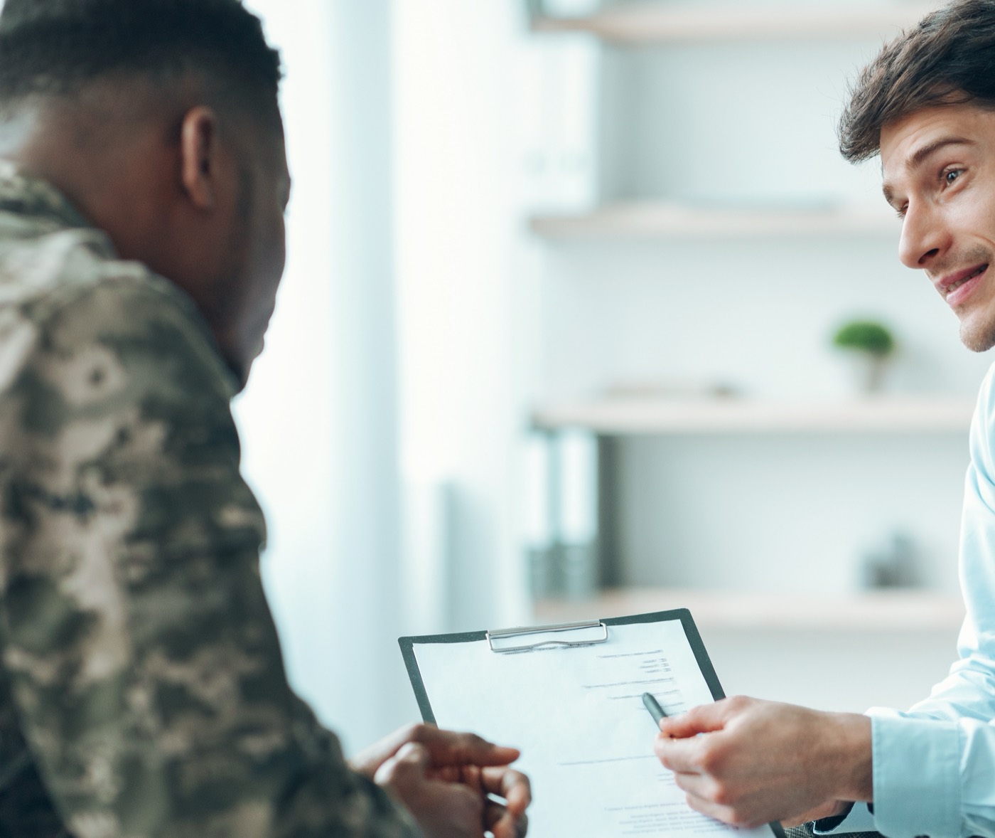 Service member reviewing VA loan options with a loan officer