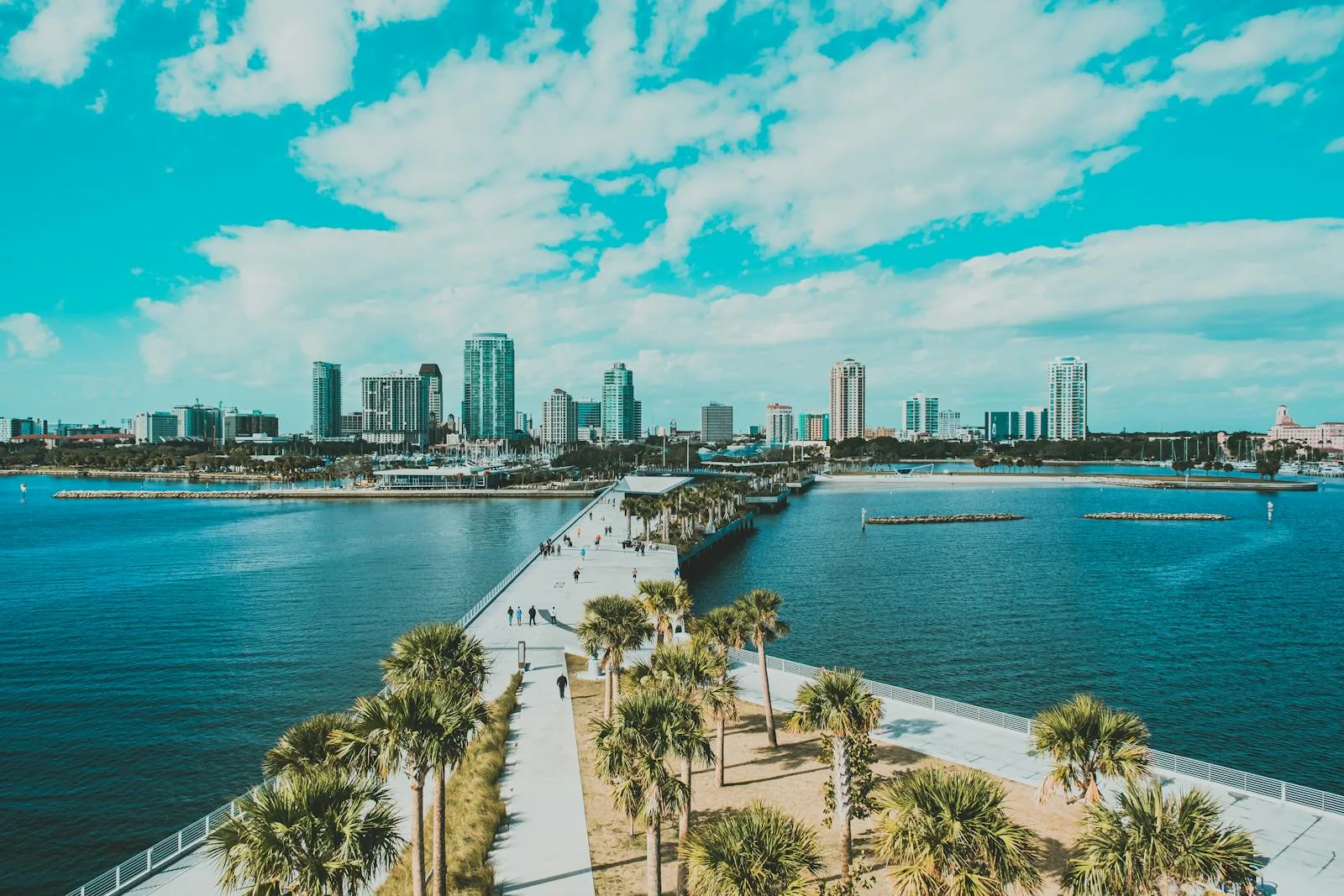 Downtown St. Petersburg skyline and the St. Pete Pier across the bay, where PBT Bancorp helps Veterans buy with VA loans