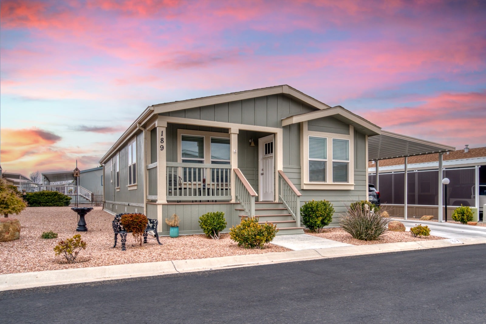 Modern manufactured home with a covered porch and tidy landscaping, the kind of home a Veteran can buy with a VA manufactured home loan
