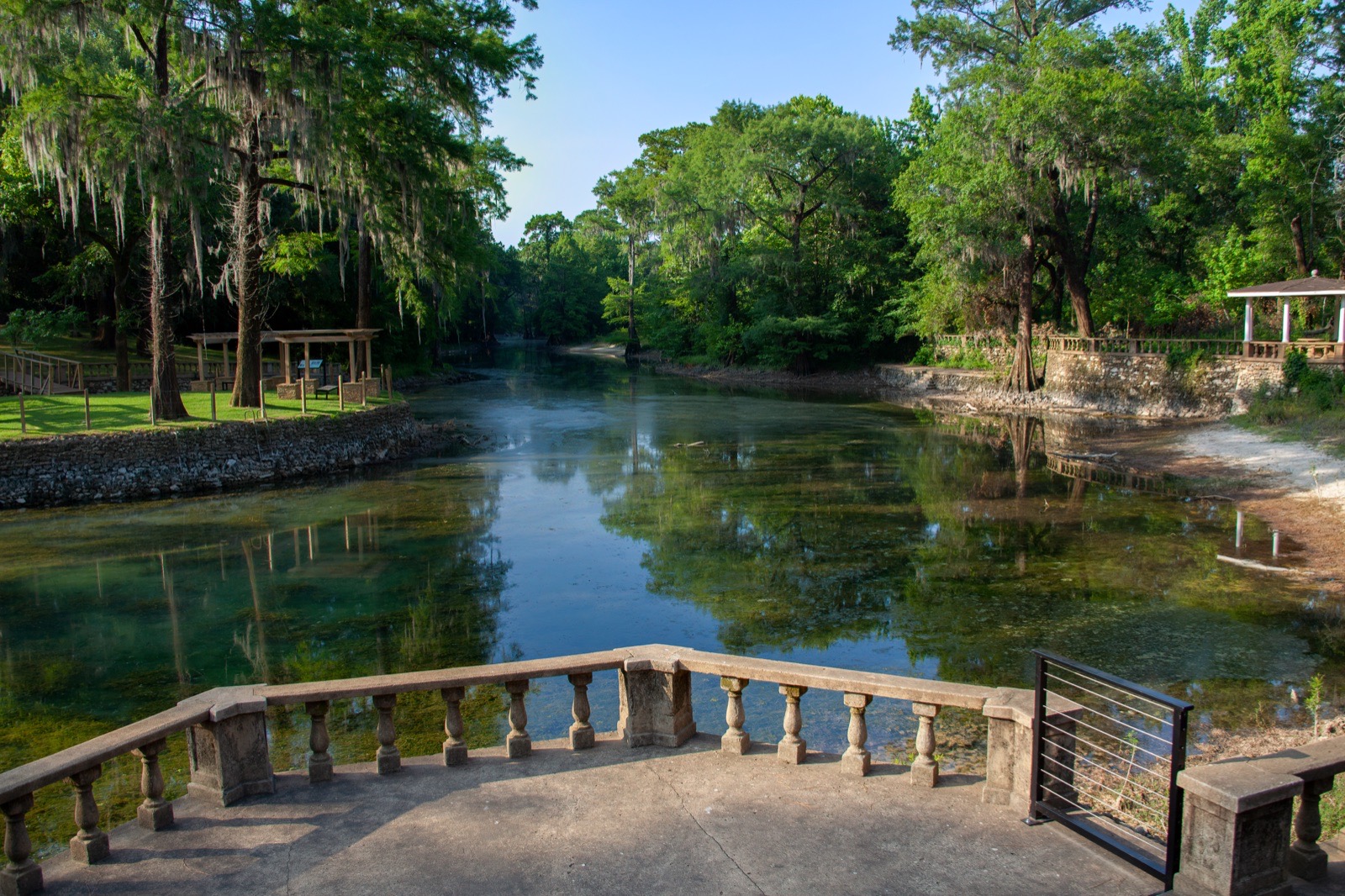 Radium Springs Gardens with clear spring water, trees, and stone terraces in Albany, Georgia