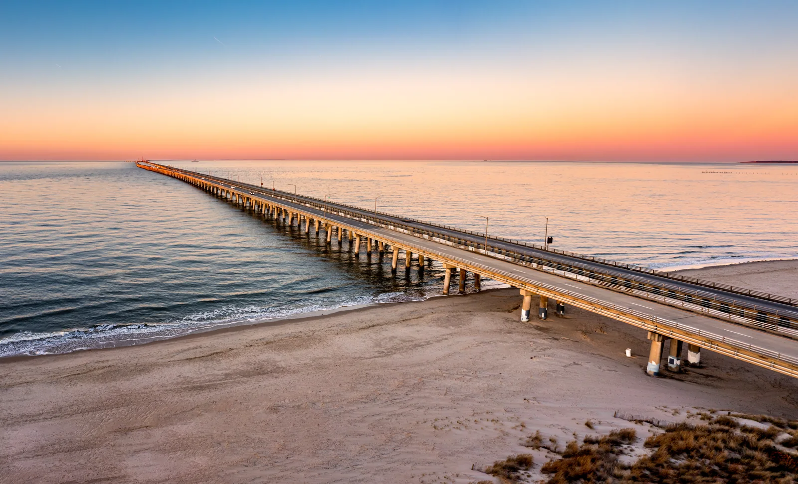 Chesapeake Bay Bridge-Tunnel extending across the water at sunset