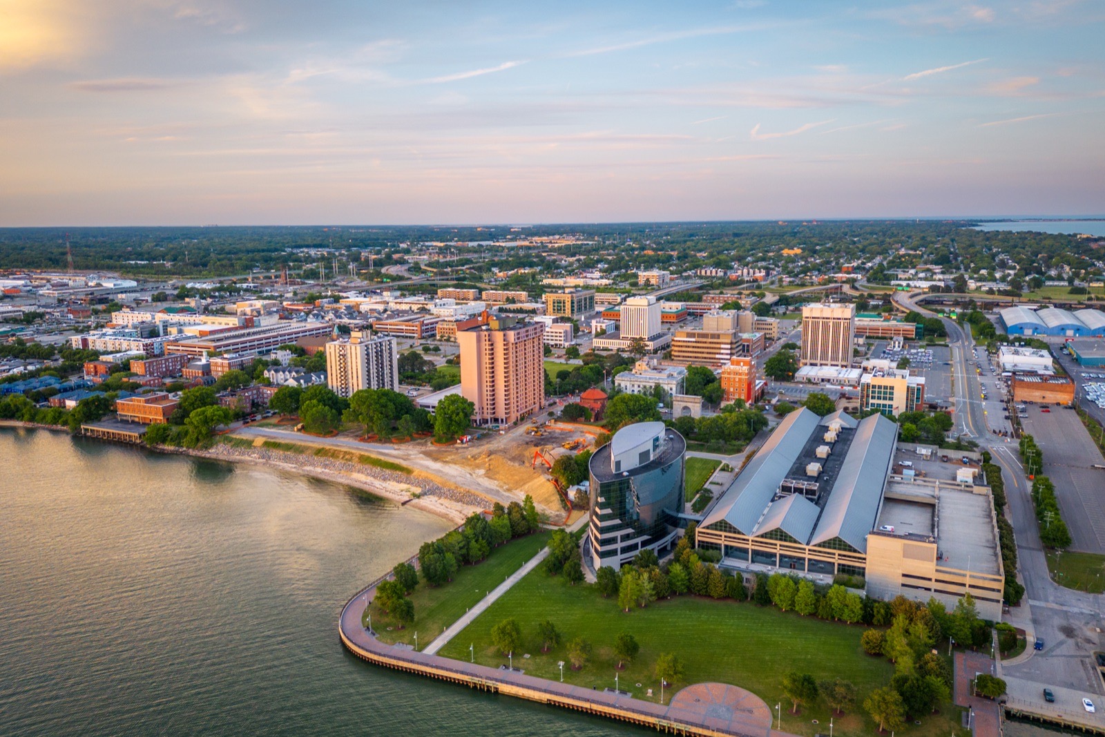 Aerial view of downtown Newport News and the James River waterfront at dusk